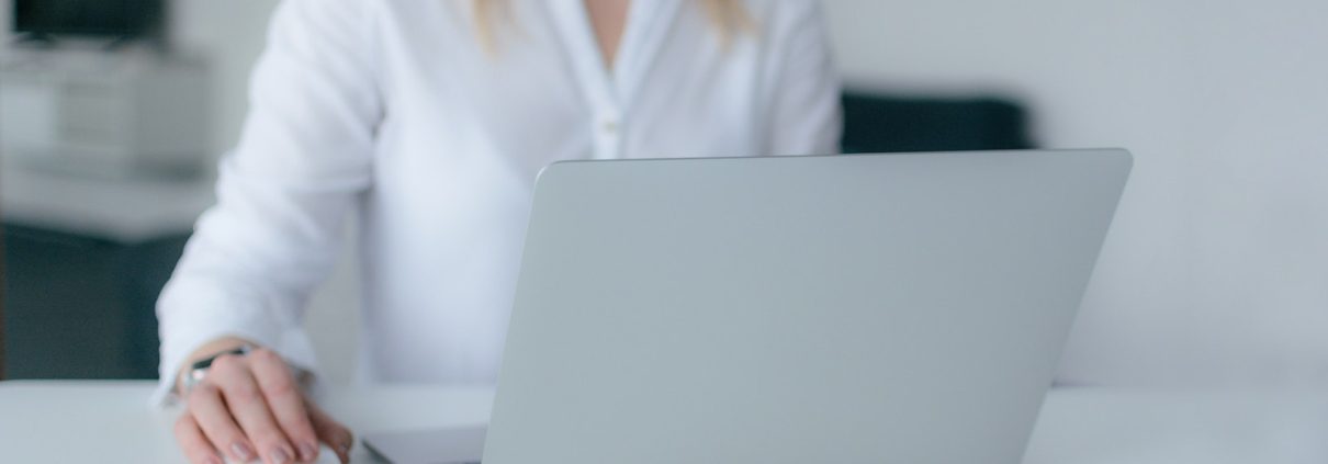 Woman Using Silver Laptop